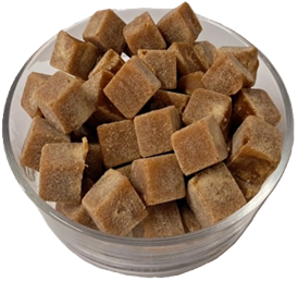 Jaggery cubes with spice oleoresins in a bowl
